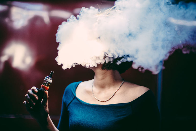 Casual Clothing Close-up Cloud - Sky Envision The Future Focus On Foreground Leisure Activity Lifestyles Nature Outdoors Part Of Personal Perspective Selective Focus Sky Smoke Smoker The Portraitist - 2016 EyeEm Awards Vape Young Women Market Reviewers' Top Picks Natural Light Portrait