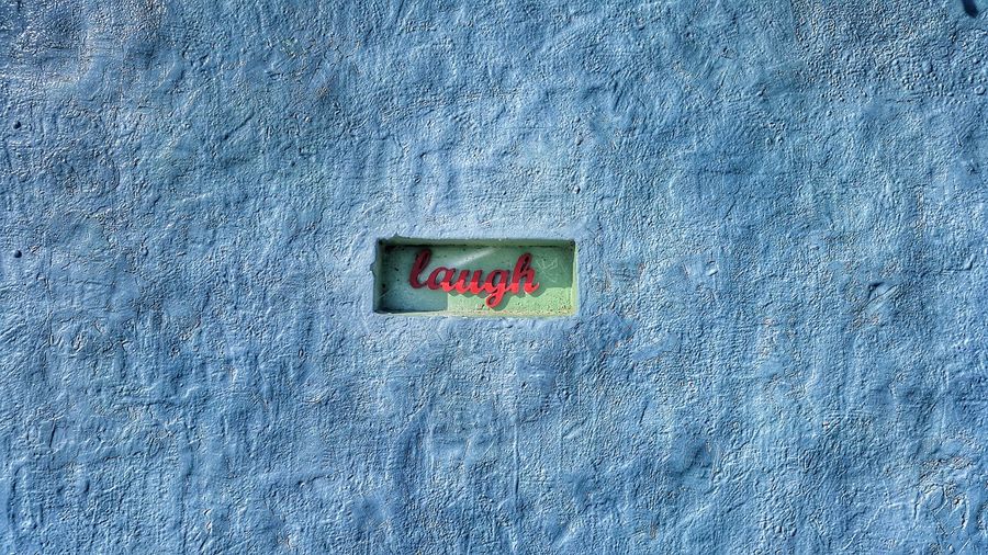Laugh text on wall