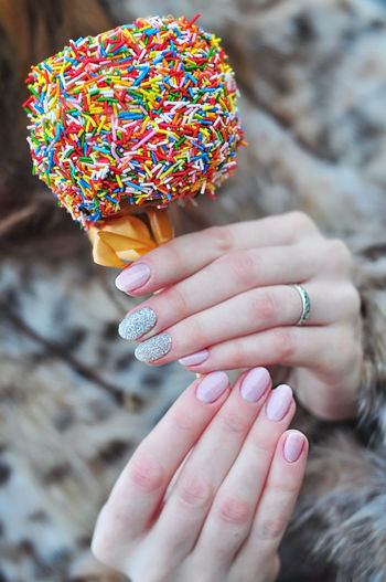 Cropped image of woman holding ice cream