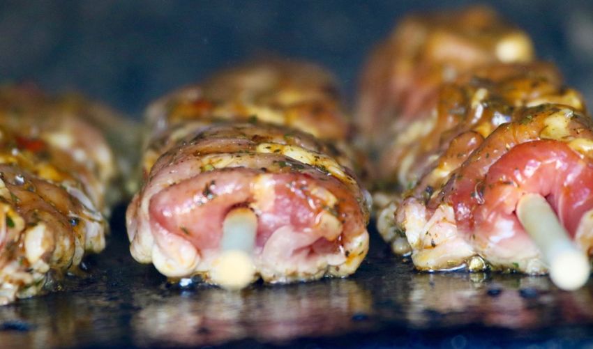 Close-up of meat in skewers on barbecue