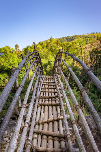 Traditional bamboo bridge for crossing river at forest at morning from different angle