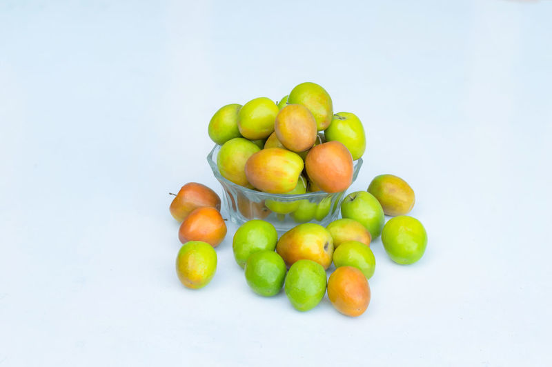 High angle view of grapes over white background
