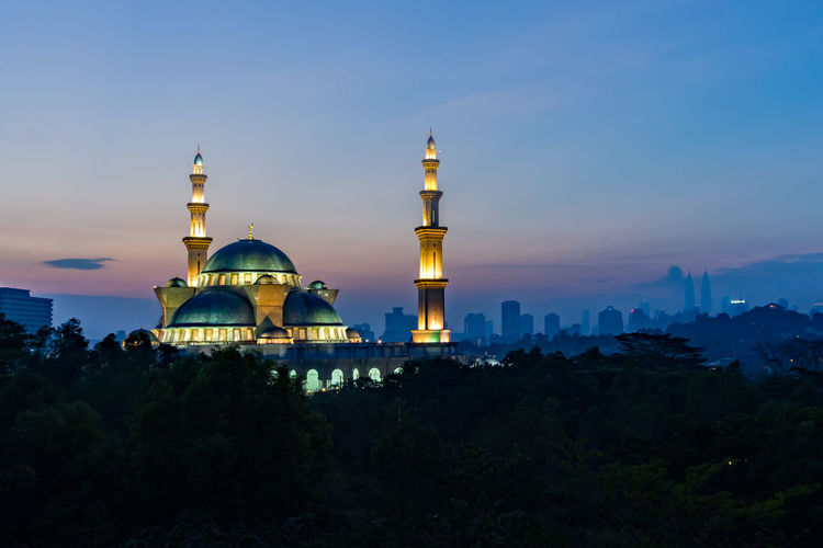 Federal territory mosque against sky during sunset