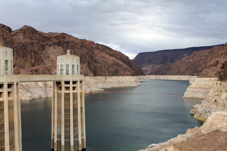 Scenic view of reservoir of hoover dam against cloudy sky