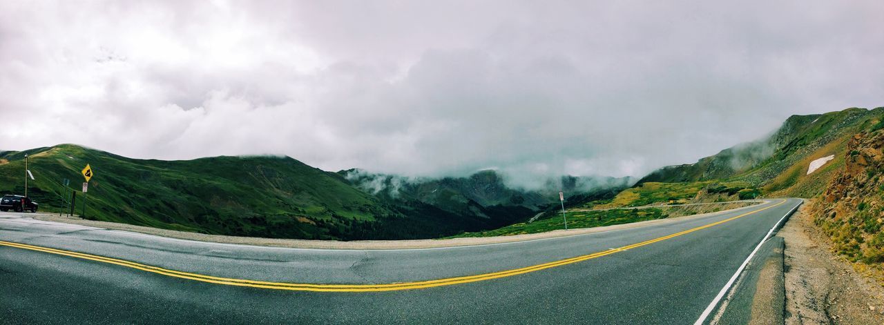 Empty road with mountain in background