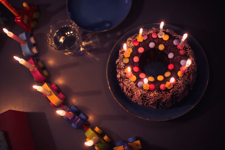 High angle view of cake with candles on table