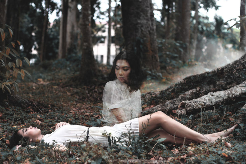 Portrait of young woman in forest