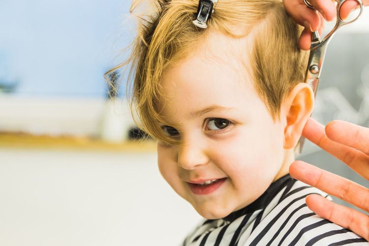 Portrait of cute girl sitting at salon