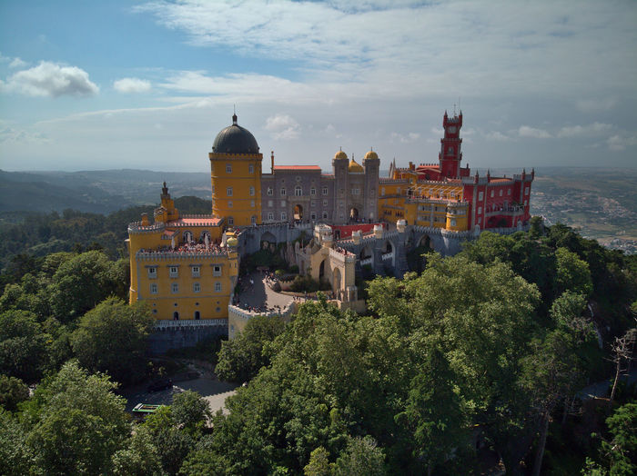High angle view of trees and buildings against sky, castle