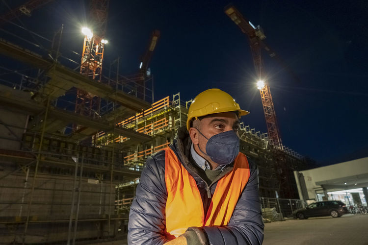 Portrait of man working at night