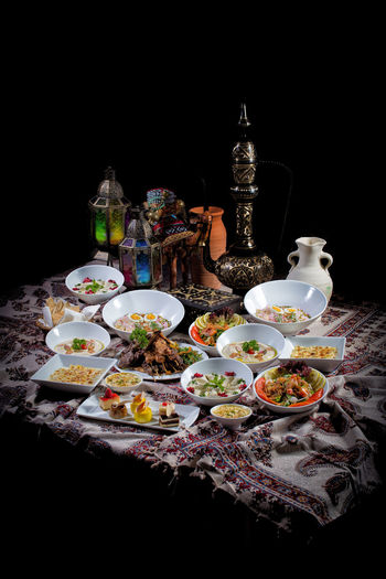 Various food on table against black background