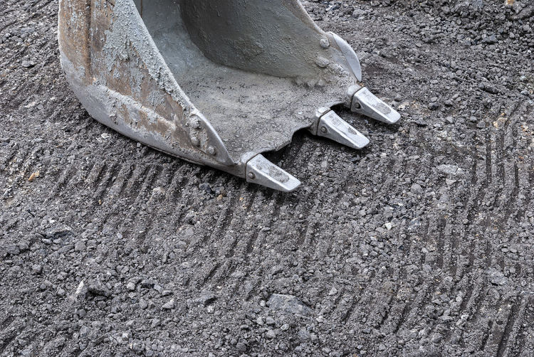 High angle view of old shoes on ground