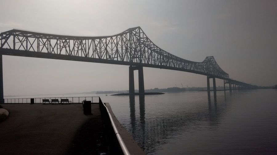 Commodore barry bridge over delaware river against sky in foggy weather