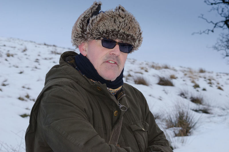 Portrait of man in snow
