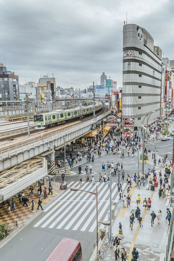 High angle view of people on road against buildings