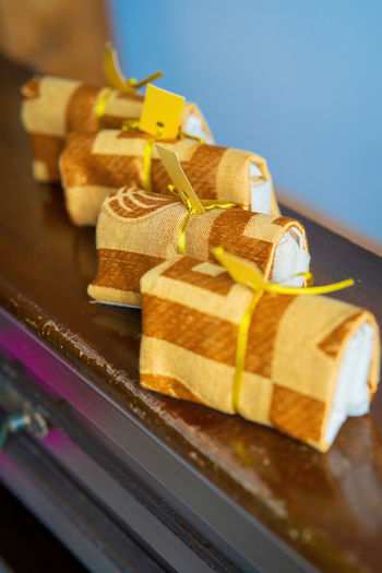 Gold themed tissue cover wrapped as wedding favour doorgifts.