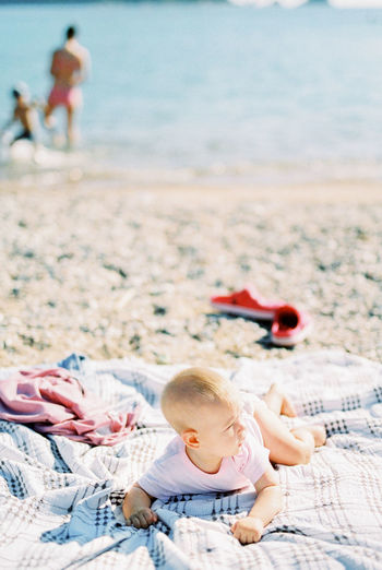 Full length of boy playing at beach