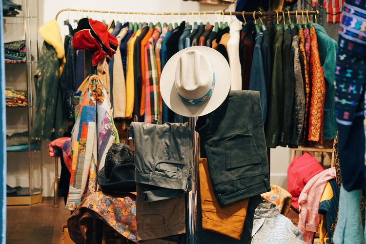 Clothes hanging in rack at store