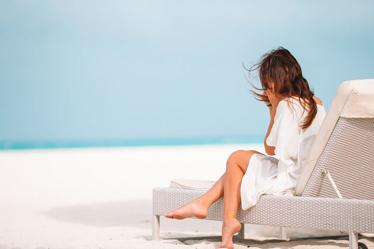 Woman sitting on beach