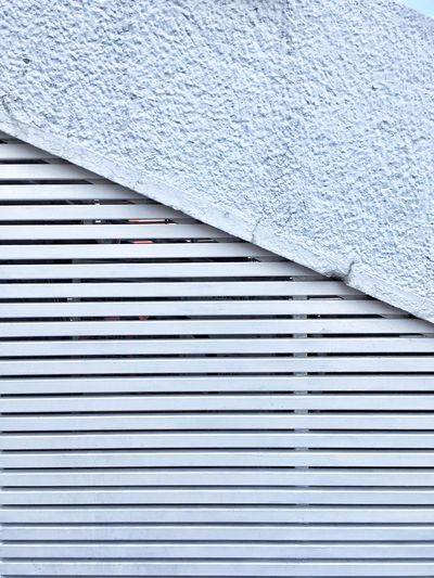 Close-up of pipe on white wall