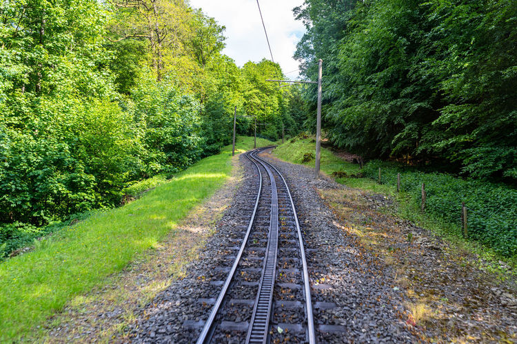 Cog railway tracks with an additional toothed rack located in the middle of the track to overcome