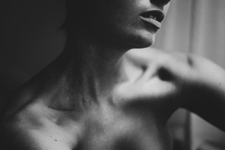 Close-up of shirtless young woman