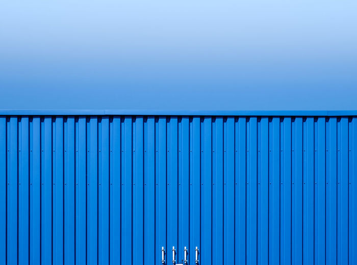 Cargo container against clear blue sky