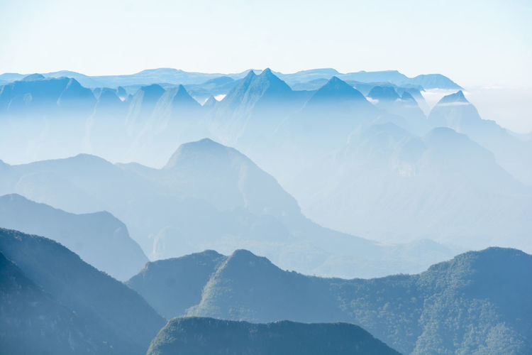 Scenic view of fog mountains against sky