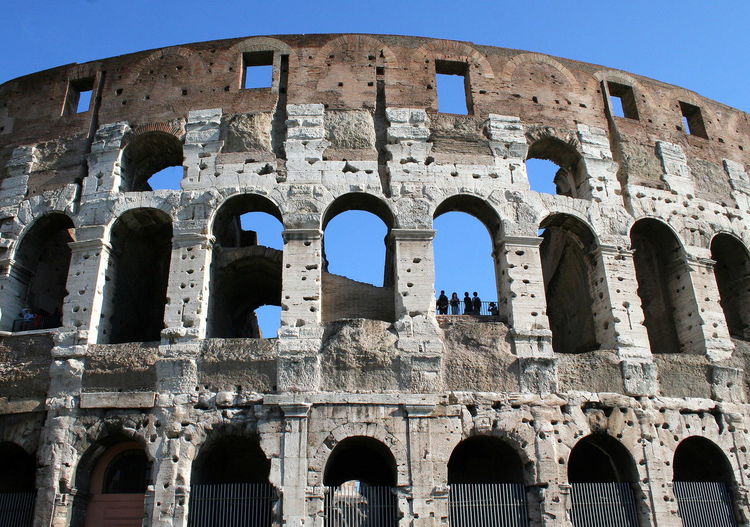 Low angle view of historical colosseum against clear sky