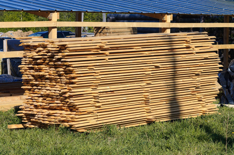 Stack of wood on field