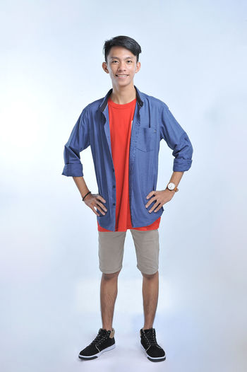 Confidence asian young man wear casual t-shirts with confident smiling