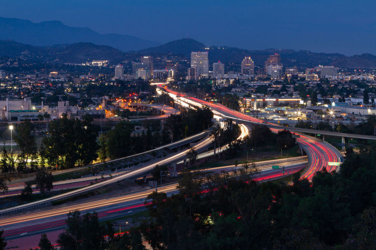 High angle view of light trails on road in city