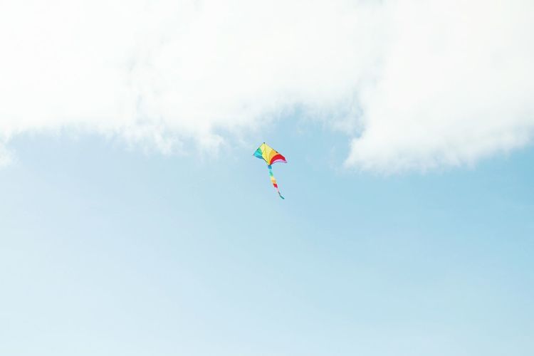 Low angle view of kite flying in sky