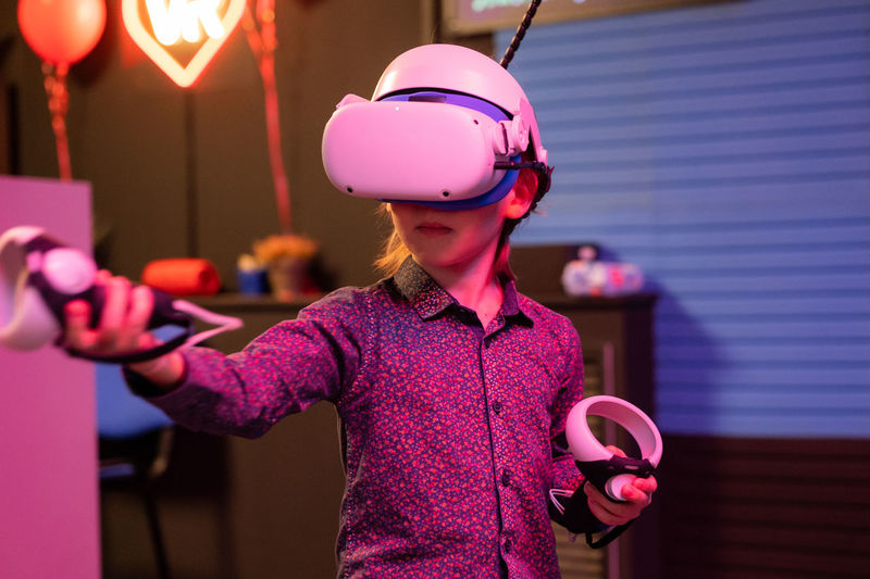 Vr game and virtual reality. kid boy gamer six years old fun playing on simulation video game