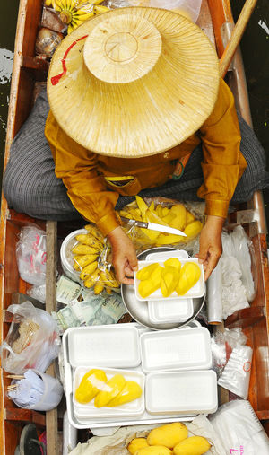Directly above shot of person selling fruits on boat