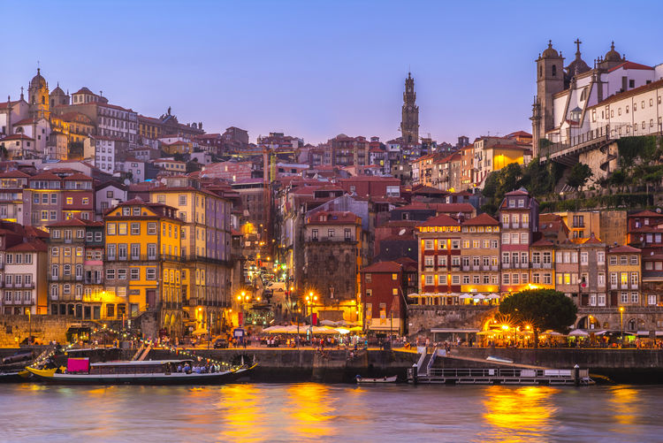 View of illuminated buildings at waterfront