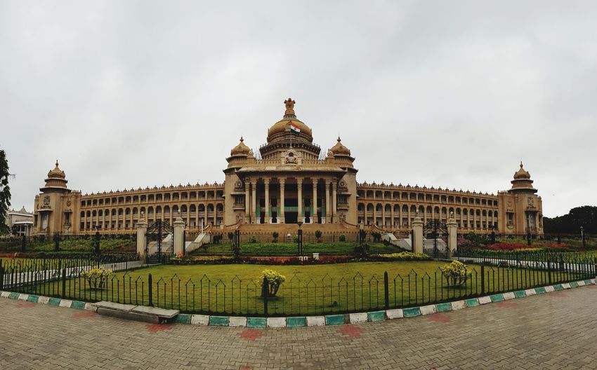 Government building against cloudy sky