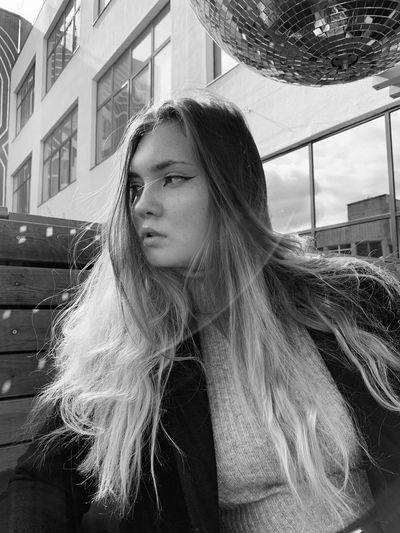 Portrait of a beautiful young woman looking away