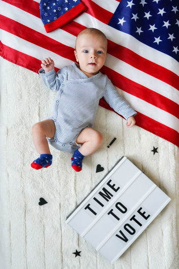 High angle view of boy playing with toy blocks on table