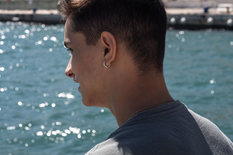 Close-up portrait of young man in sea