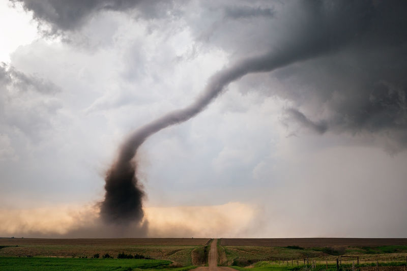 A tornado spins beneath a supercell thunderstorm during a severe weather outbreak in nebraska.
