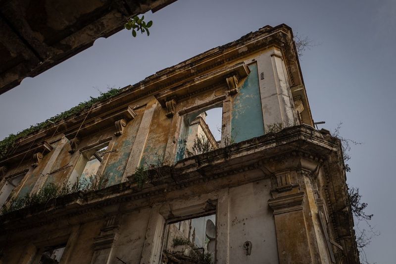 Low angle view of old building against sky