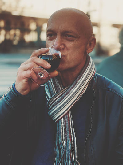Portrait of man holding a glas of red wine