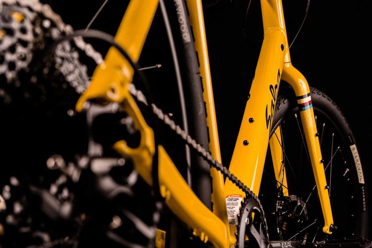 Close-up of yellow bicycle wheel
