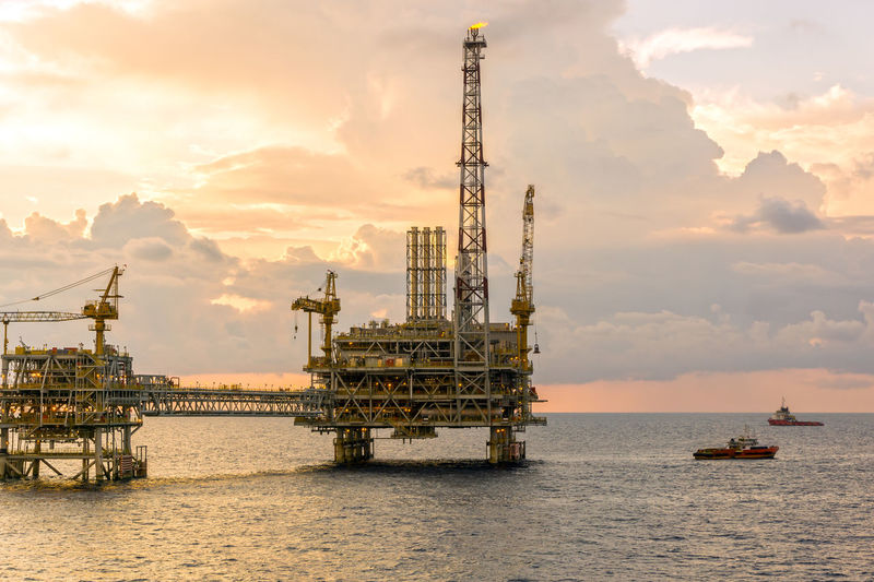 Seascape of an oil production platform during sunset at offshore terengganu oil field