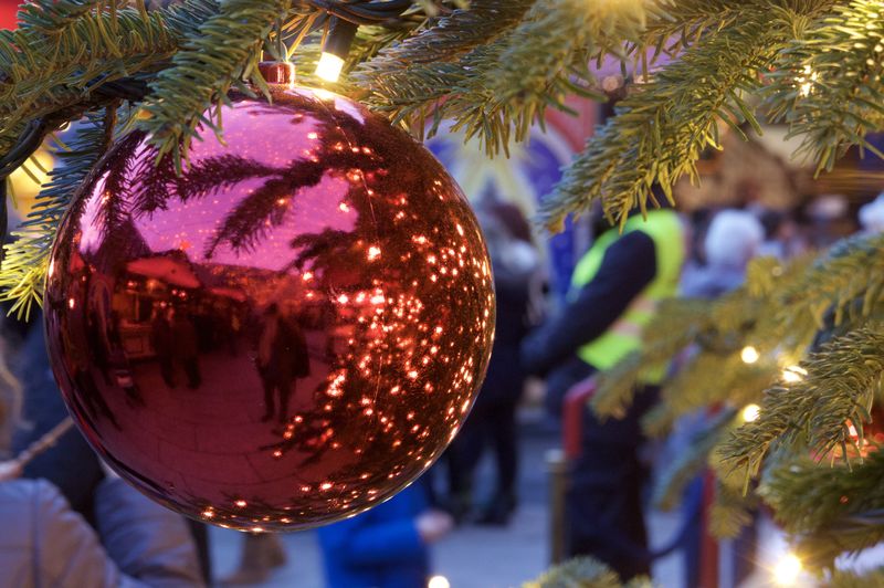 Close-up of christmas tree with christmas ball at night