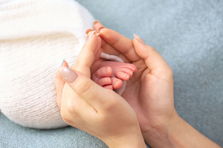 Newborn baby feet. motherhood concept. mother day.  newborn baby feet. motherhood. mother day