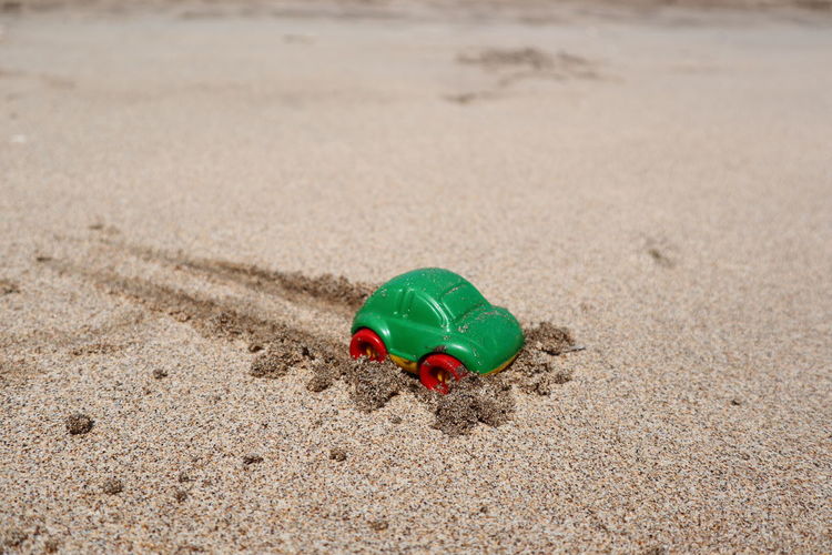 Close-up of a toy on sand