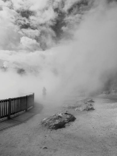 Scenic view of foggy weather against sky