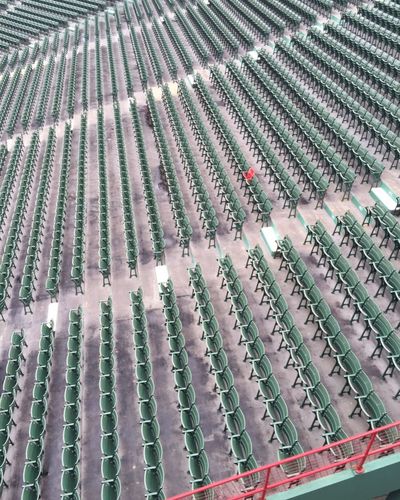 High angle view of green chairs in rows
